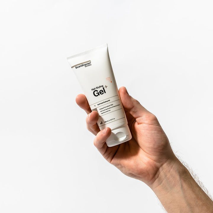 Person holding Scandinavian Biolabs Hair Styling Gel – angled shot